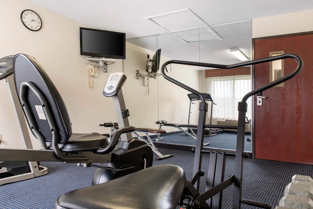 Modern exercise room with treadmills and weights